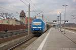 253 014-9 PRESS (223 051-4) mit einem Holzzug, bei der Durchfahrt in Rathenow und fuhr nach Niedergrne weiter.