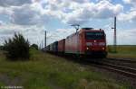185 013-0 DB Schenker Rail Deutschland AG mit einem Containerzug in Demker und fuhr in Richtung Stendal weiter. 09.06.2012