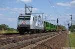 185 540-2  Kassel Huskies  TX Logistik AG fr Raildox GmbH & Co. KG mit einem Holzzug in Friesack(Mark) in Richtung Neustadt(Dosse) unterwegs. 25.05.2011 