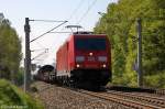 185 372-0 mit einem gemischtem Güterzug bei Nennhausen und fuhr in Richtung Wustermark weiter.