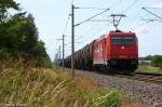 185 606-1 Alpha Trains für HGK - Häfen und Güterverkehr Köln AG  HGK 2064  mit einem Kesselzug  Umweltgefährdender Stoff, flüssig  bei Nennhausen und fuhr in Richtung Wustermark weiter. 29.06.2012