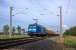 145 030-7 PRESS (145 085-7) mit einem Holzzug bei Nennhausen und fuhr in Richtung Rathenow weiter. 06.07.2012