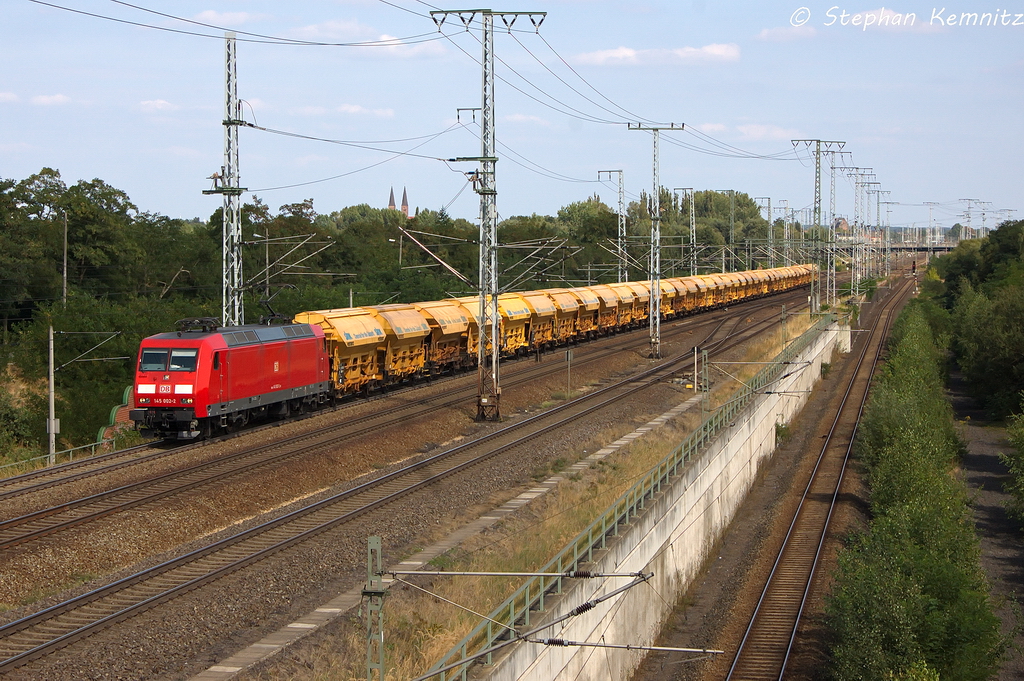 145 002-2 DB Schenker Rail Deutschland AG mit einem Harnstoffzug in Stendal(Wahrburg) und fuhr in Richtung Wittenberge weiter. 22.08.2013