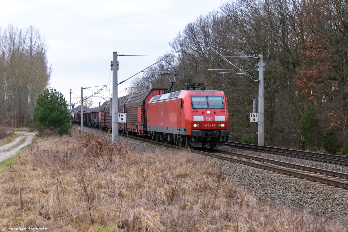 145 048-5 DB Cargo mit einem gemischtem Güterzug in Nennhausen und fuhr weiter in Richtung Wustermark. 12.02.2016
