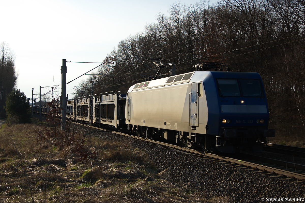 145-CL 203 (145 099-8) Alpha Trains für Crossrail AG mit einem fast leeren Autotransportzug in Nennhausen und fuhr weiter in Richtung Wustermark. 28.03.2015