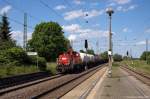 261 064-0 DB Schenker Rail Deutschland AG mit einem Nahgterzug nach Magdeburg-Rothensee, bei der Durchfahrt in Wolmirstedt.