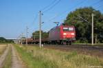 145 023-8 DB Schenker Rail Deutschland AG mit einem gemischtem Gterzug bei Rathenow und fuhr in Richtung Stendal weiter. 01.08.2012
