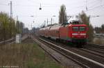 112 182 mit dem RE3 (RE 18311) von Stralsund Hbf nach Elsterwerda, bei der Durchfahrt in Berlin-Karow. 04.04.2014