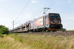 187 538-4 HSL Logistik GmbH mit einem Autotransportzug in Nennhausen und fuhr weiter in Richtung Wustermark.